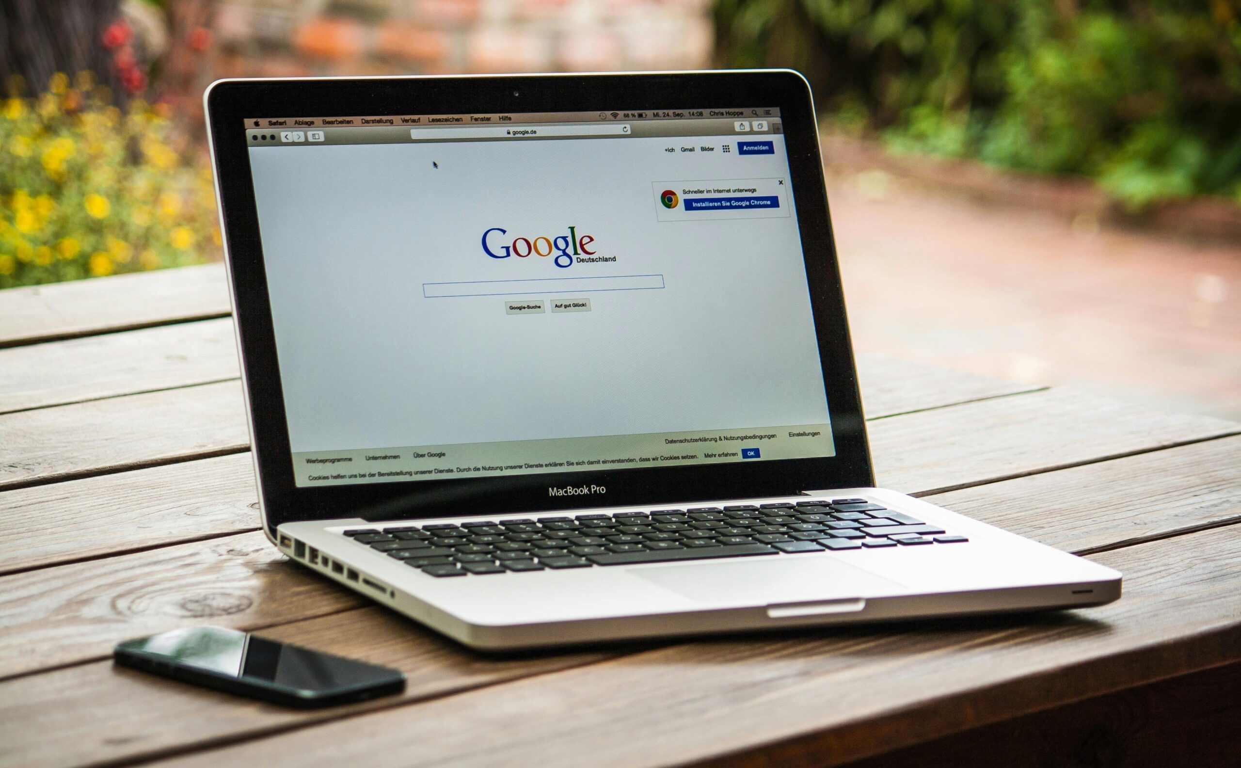 Laptop on a desk with Google search page open